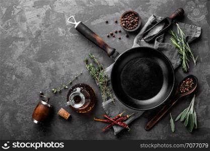 dark culinary background with empty black pan and space for text recipe or menu