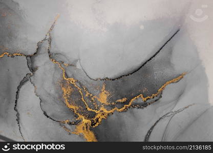 Dark gold abstract background of marble liquid ink art painting on paper . Image of original artwork watercolor alcohol ink paint on high quality paper texture .. Dark gold abstract background of marble liquid ink art painting on paper .