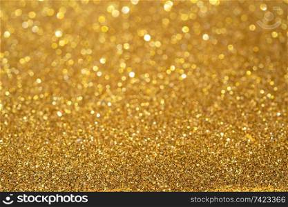 dark golden glitter abstract background, shining cose up texture. golden glitter abstract background