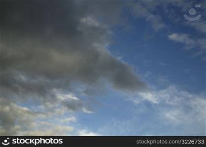 Dark Gray Clouds In A Blue Sky