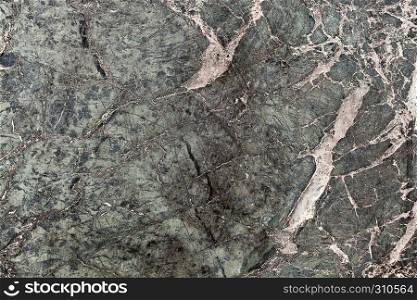 Dark green marble tile texture background with white and black cracks