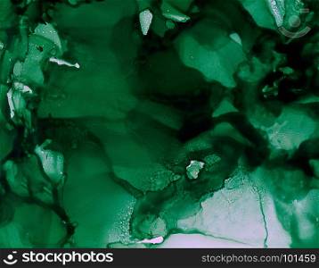 Dark green uneven splashes.Colorful background hand drawn with bright inks and watercolor paints. Color splashes and splatters create uneven artistic modern design.