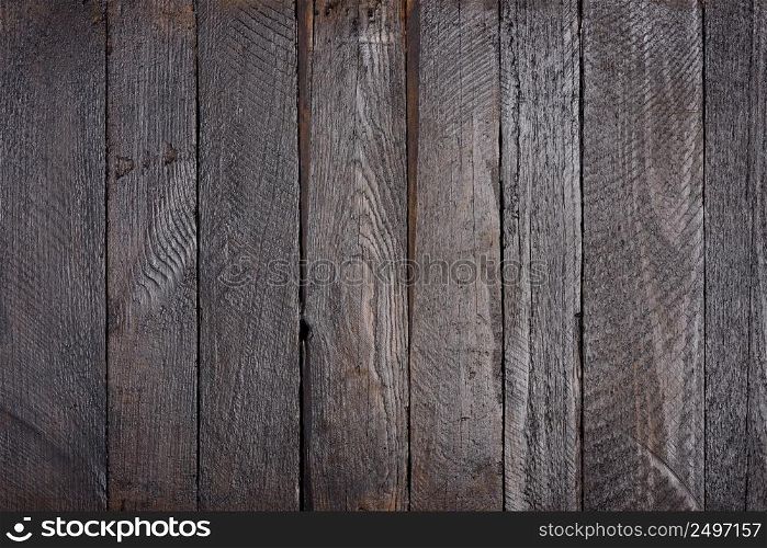 Dark grunge wooden planks table texture flat lay