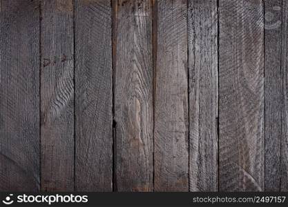 Dark grunge wooden planks table texture flat lay