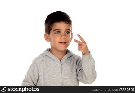 Dark haired child showing two fingers isolated on a white background