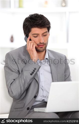 Dark haired man working from home