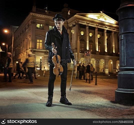 Dark-haired young guy with the violin