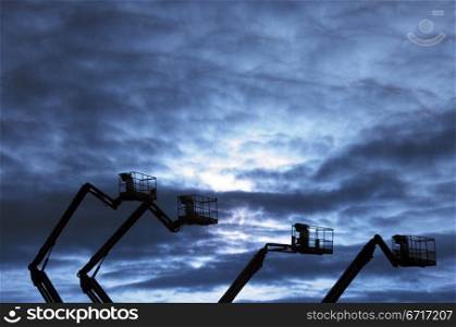 dark industrial landscape at sunset against the cloudy sky