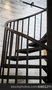 Dark iron metal spiral staircase, stock photo