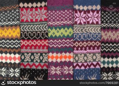 Dark knitted background with the national winter pattern.