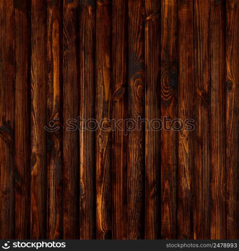 Dark old wooden table background from vertical planks top flat view