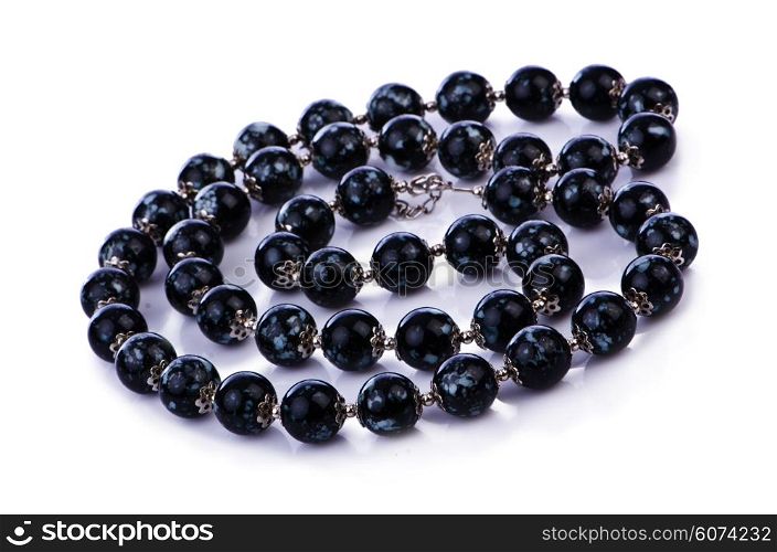 Dark pearl necklace isolated on the white