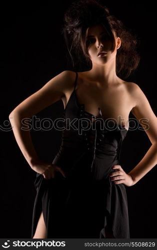 dark picture of sexy woman in black dress