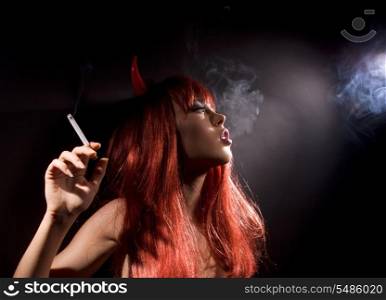 dark picture of smoking naked devil woman