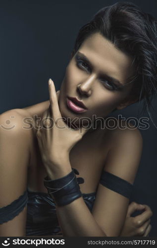 Dark portrait of a woman on a dark blue background