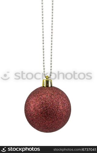 dark red christmas bauble over white background