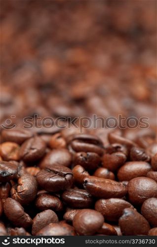 dark roasted coffee beans close up background