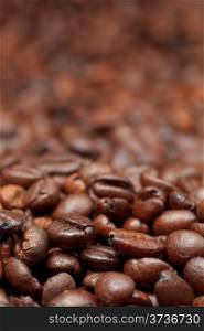 dark roasted coffee beans close up background