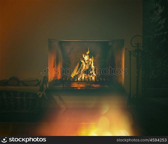 Dark room with fire in fireplace