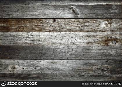 dark rustic weathered barn wood background with knots and nail holes