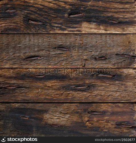 Dark rustic wooden planks with rustic nails background