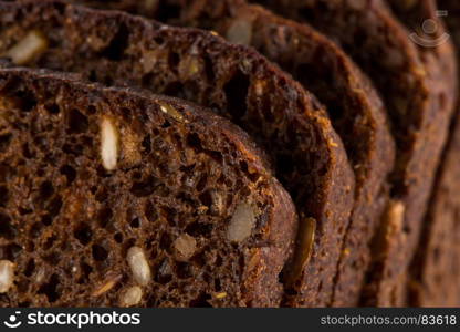 Dark rye bread with sunflower seeds background