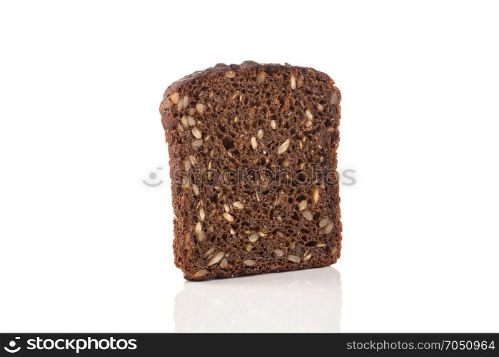 Dark rye bread with sunflower seeds on a white background