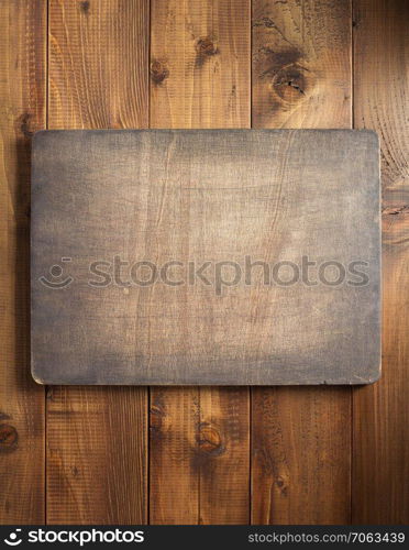 dark sign board at wooden background texture