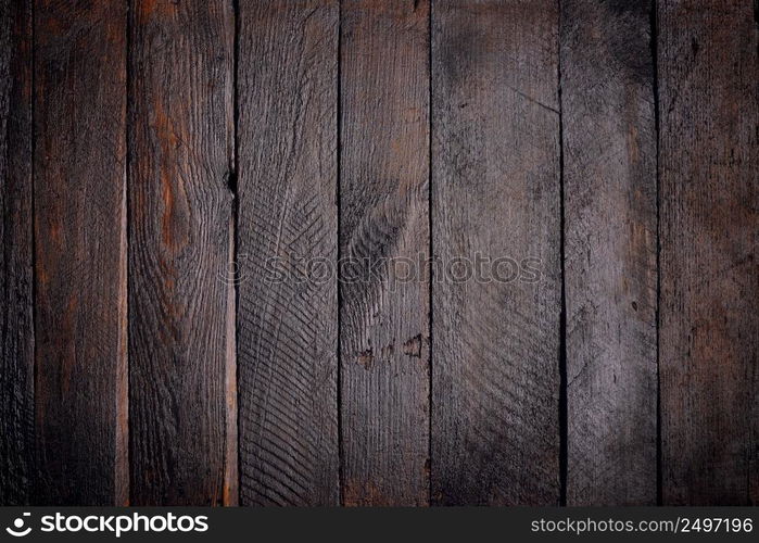 Dark stained wooden planks background