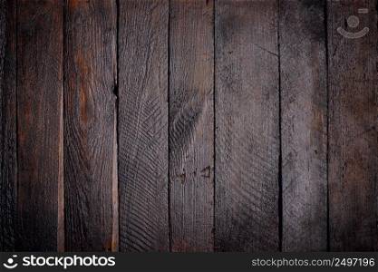 Dark stained wooden planks background