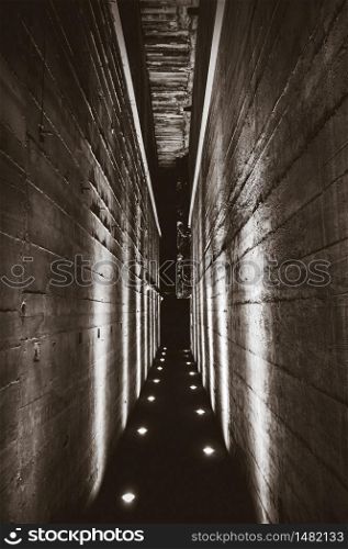 Dark tunnel corridor in a war bunker. Black and white photography. Dark tunnel in a bunker. Black and white photography