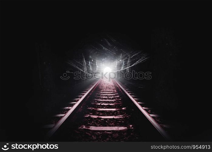 Dark tunnel of the railroad and cobweb or spider