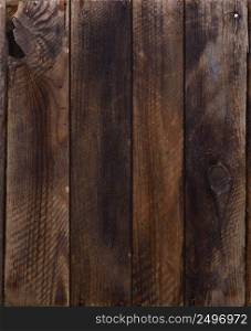 Dark weathered wooden planks with rusty nails background