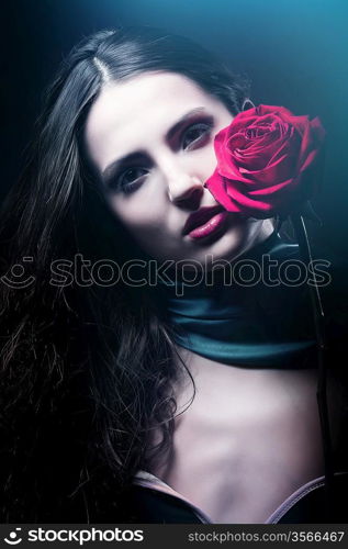 dark woman with red rose