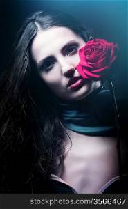 dark woman with red rose