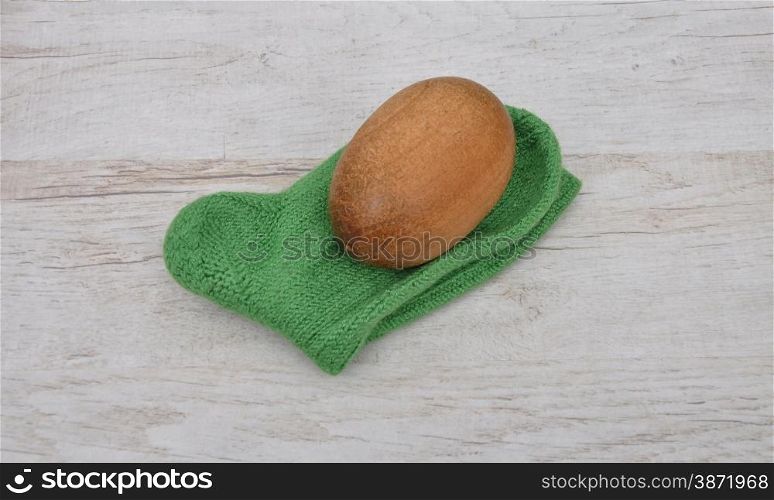 Darning egg and hand-knitted sock