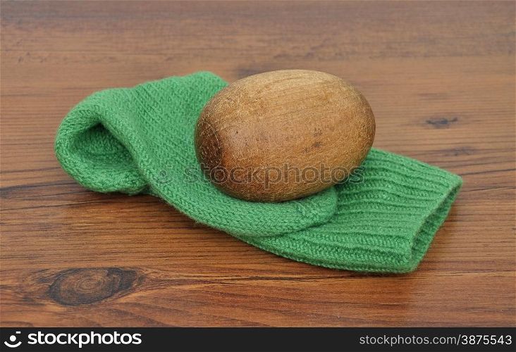 Darning egg with hand-knitted sock