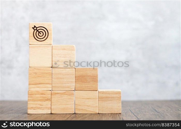 dartboard block over stack of building with business goal, strategy, target, mission, action, objective, aim and success concept