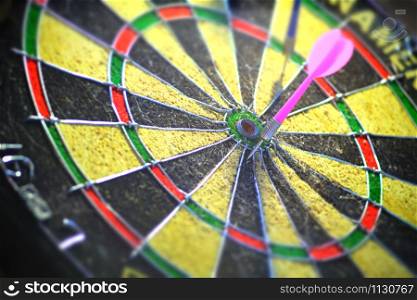 Darts board in black and yellow.