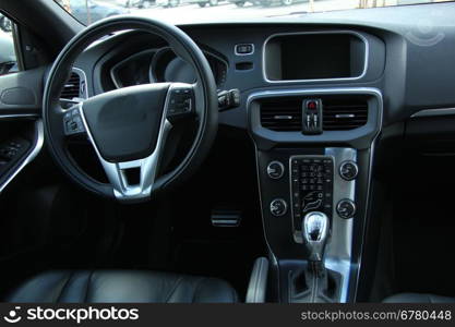 Dashboard and interior of a brand new car, leather and stainless steel