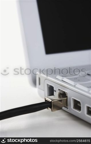 Data wire connected to laptop computer.