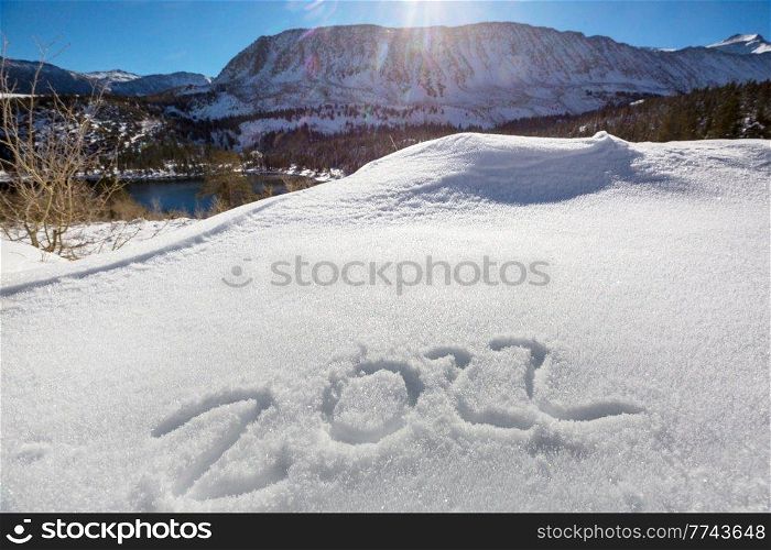 Date 2022 in snow and the symbol of the New Year