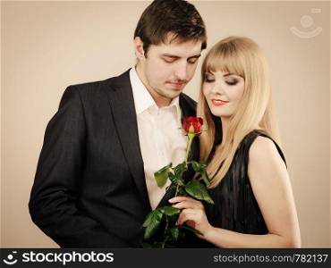 Date flirt and love concept. Valentine's Day. Attractive blonde woman with handsome man dating. Elegant glamorous couple pare fall in love.. Elegant couple on perfect date.