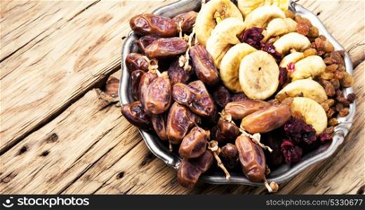 dates and figs. Dish with oriental sweets, dates and figs