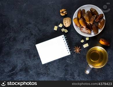 dates fruit plate with notepad tea