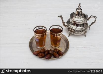 dates fruit with glasses tea table