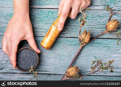 datura plant in folk medicine. Hands with pestle, preparing medicinal potion from medicinal herb