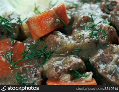 Daube stew - classic Provenca French stew made with inexpensive beef braised in wine, vegetables, garlic
