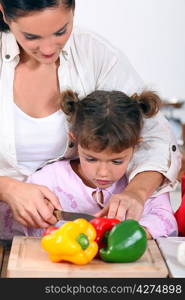 Daughter cooking with mother