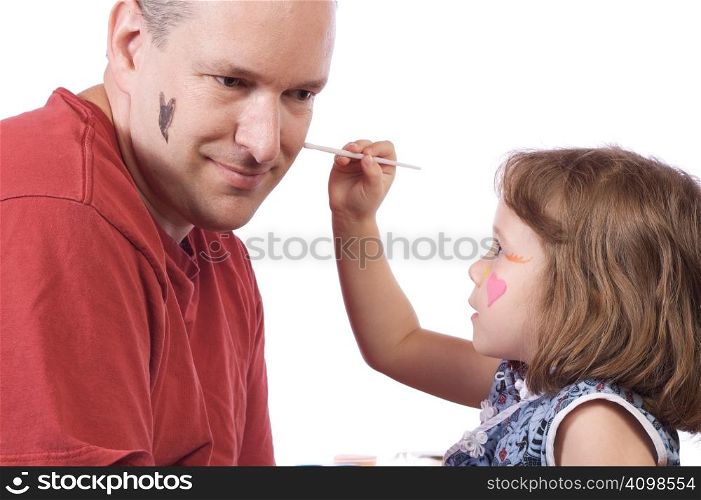 Daughter doing an halloween make-up to her dad